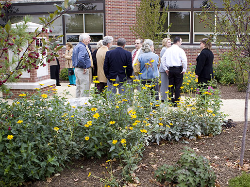 a crowd enjoying the pet tribute garden