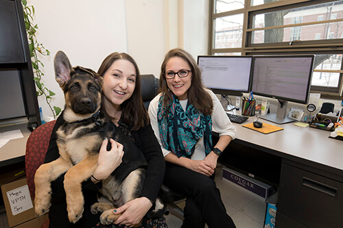 Dr. Maggie O'Haire, PVM assistant professor of human-animal interaction, with Kerri Rodriguez, human-animal interaction graduate student in PVM’s Department of Comparative Pathobiology, and her dog Hendrix.