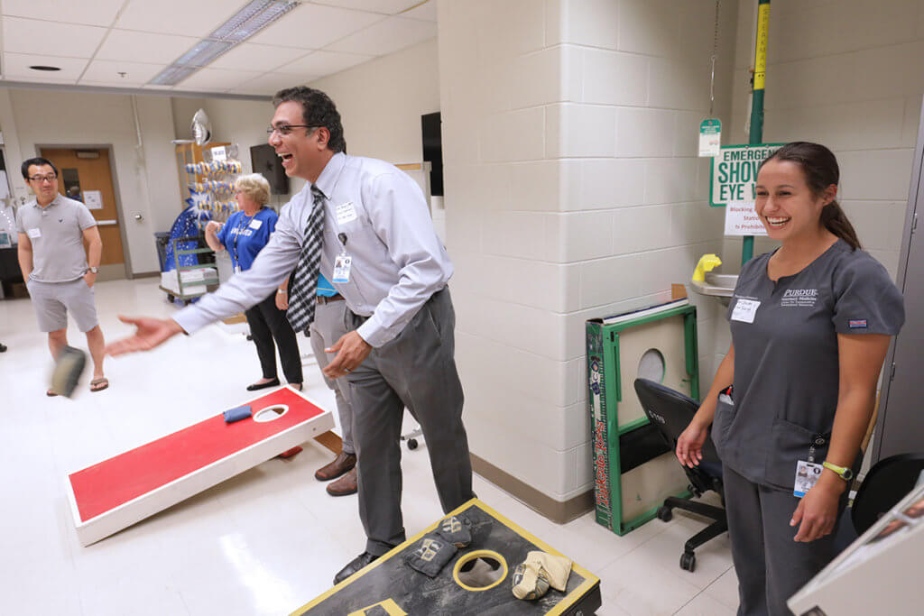 Dr. Narayanan and Christa Crain pictured at cornhole tournament