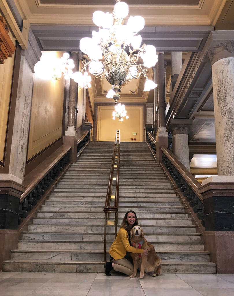 Brittany Vale pictured with Chloe the dog at the Indiana Statehouse