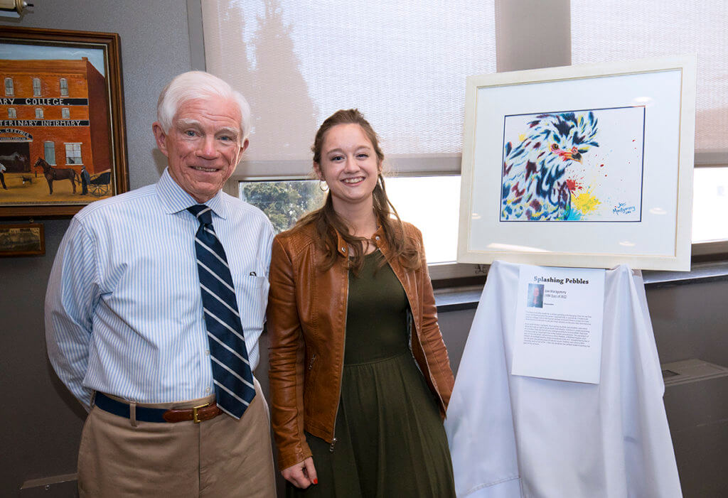 Joni Montgomery pictured with Professor David Williams and her watercolor