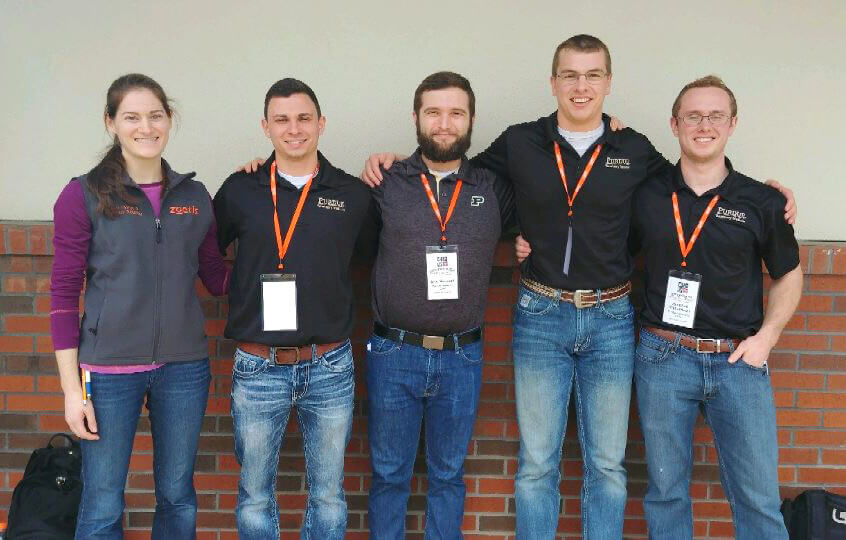 Team members of the Bovine Palpation Team stand together for a photo outside