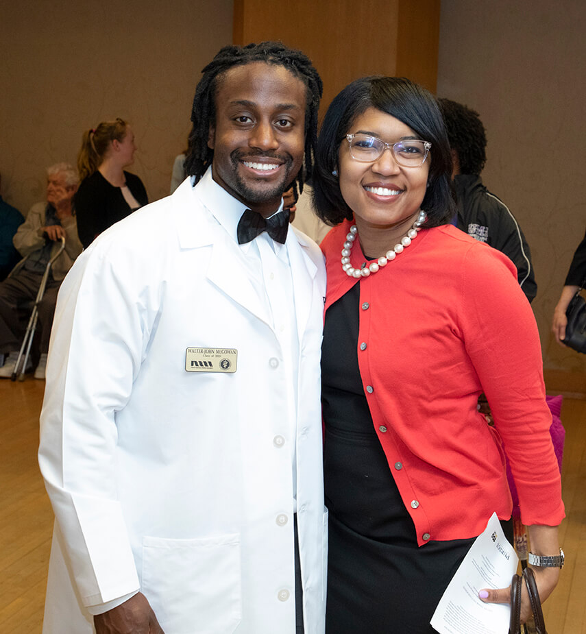 Walter-John McGowan stands beside Latonia Craig for a photo during the reception