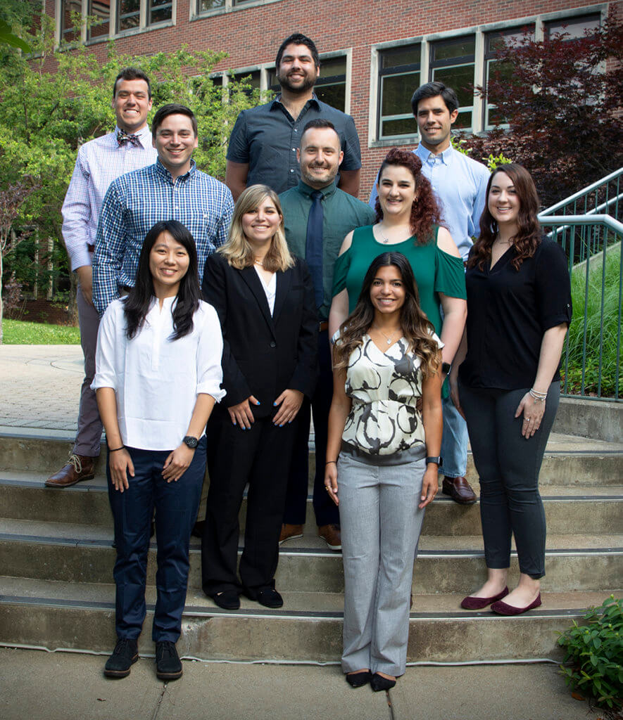 interns gather for a group photo on the Lynn Hall Courtyard steps