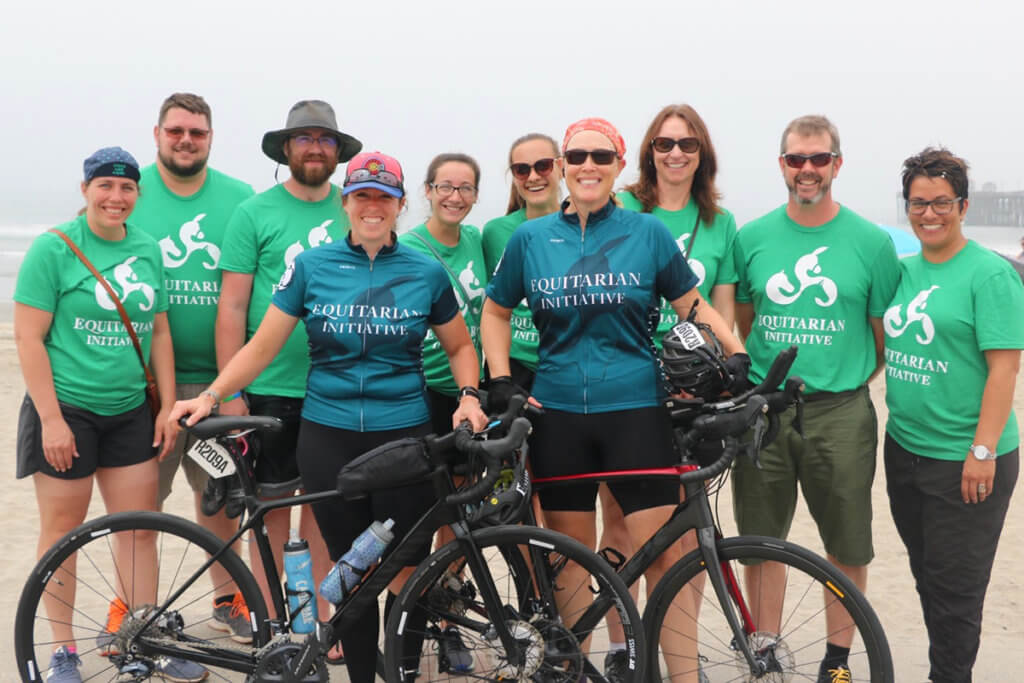 Team Workhorses pause for a group photo on the beach