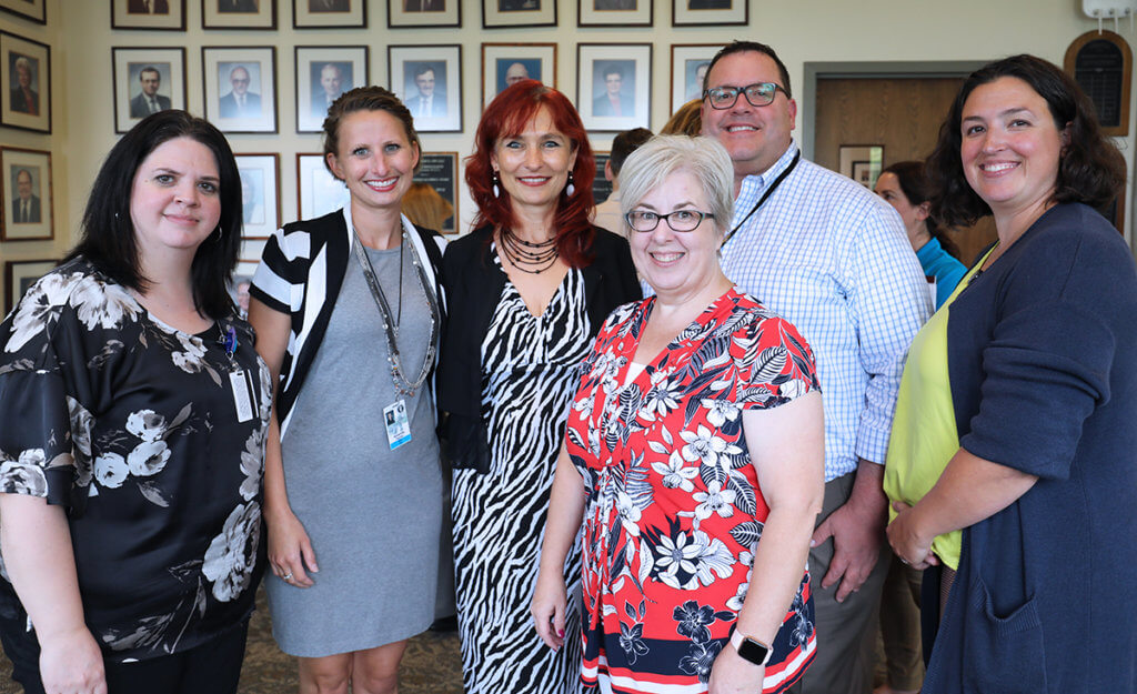 Dr. Nan stands with her Student Services colleagues at her farewell reception