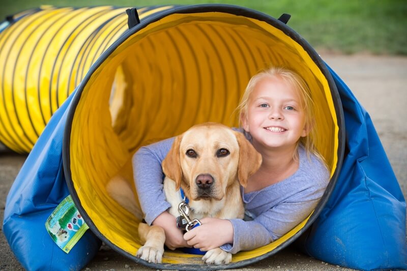 Service Dog and Girl in Tunnel