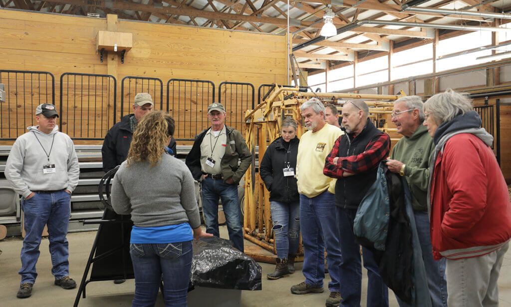 Dr. Koziol speaks to a group of attendees in the Equine Health Science Annex