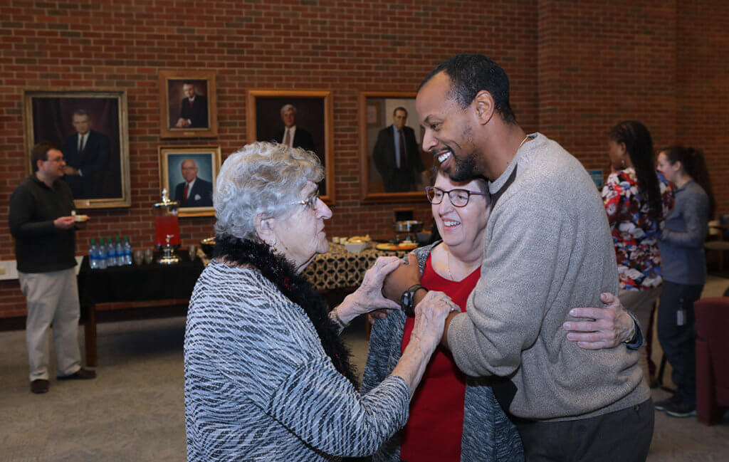 Dr. Green smiles as he gives Kris a hug as he and Kris listen to her mom