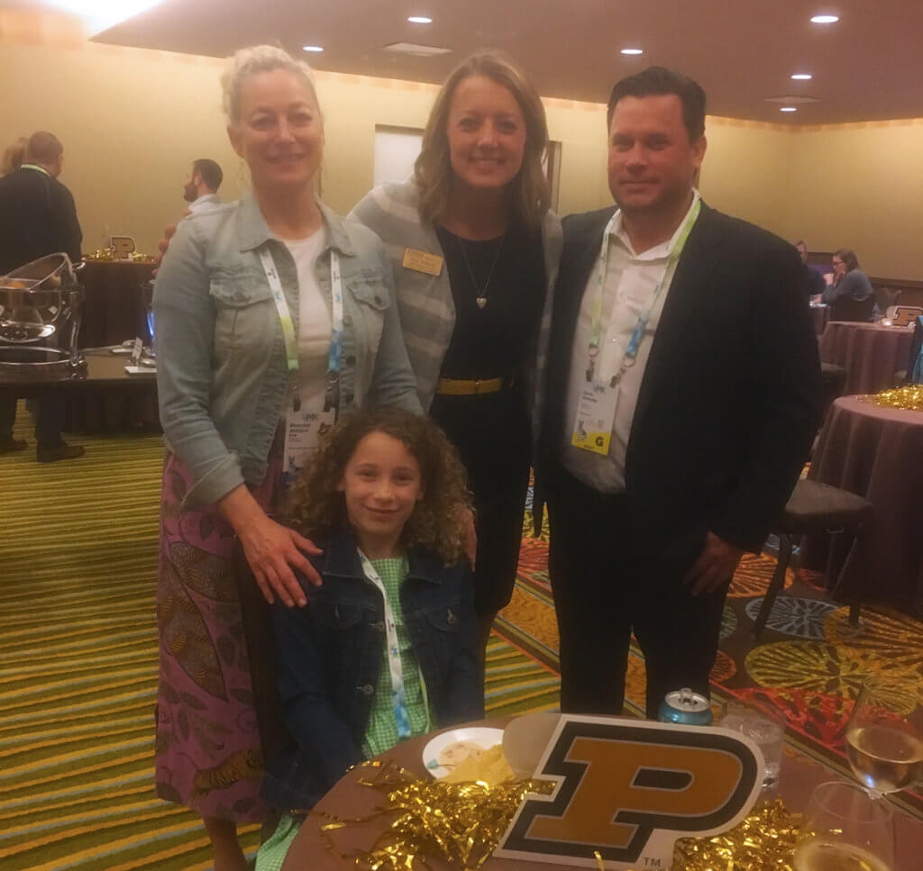 Tanya joins Dr. Willard, her husband Chris and daughter at their table at the alumni reception