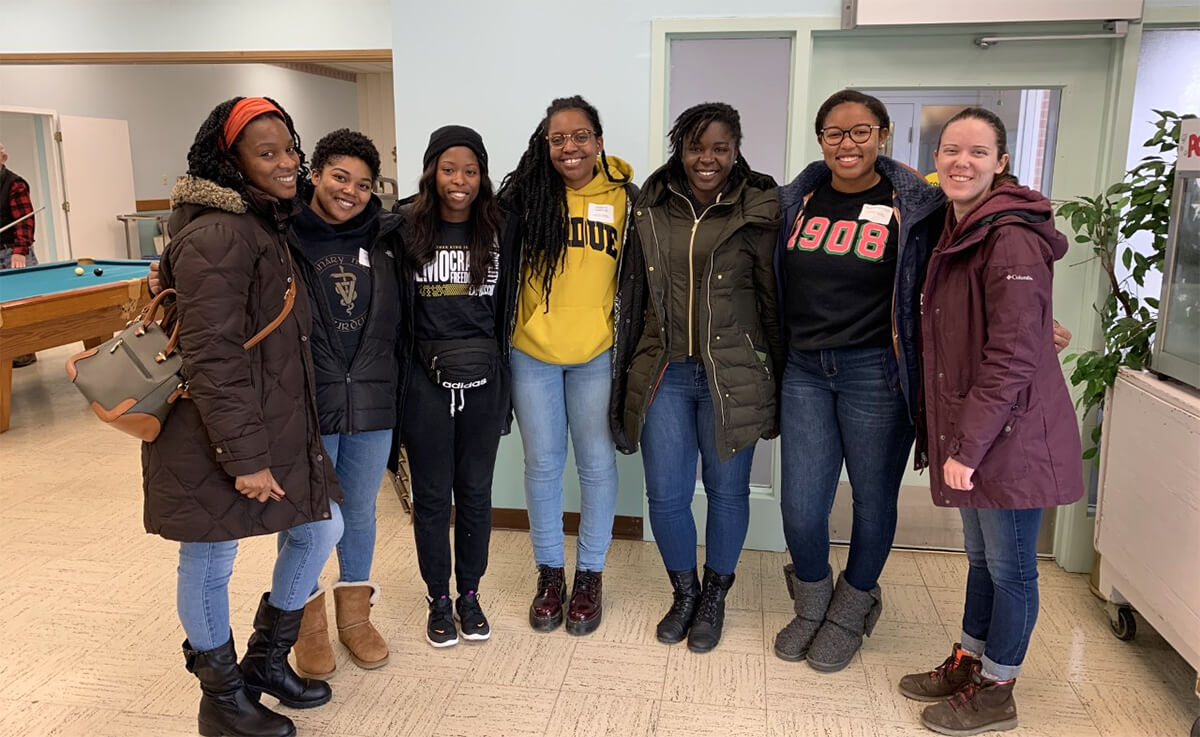 A group of female students pause for a group photo