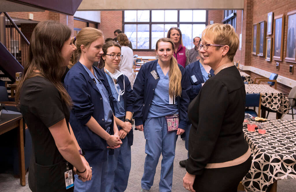 Dr. Lowery speaks with a group of veterinary nurses at her welcome reception