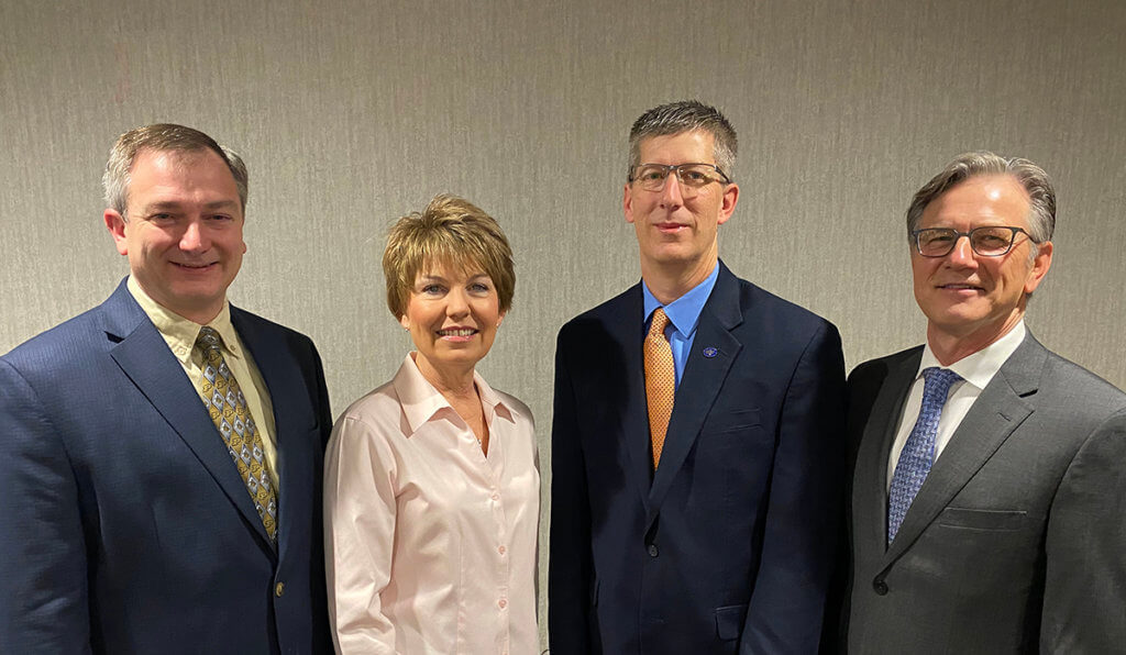 The board members stand together for a group photo