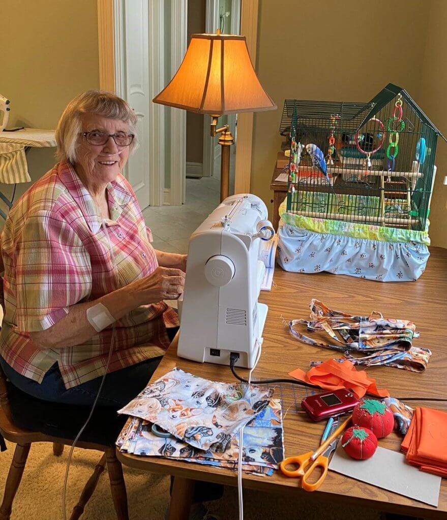 Dr. Lowery's mom sits in front of her sewing machine at work