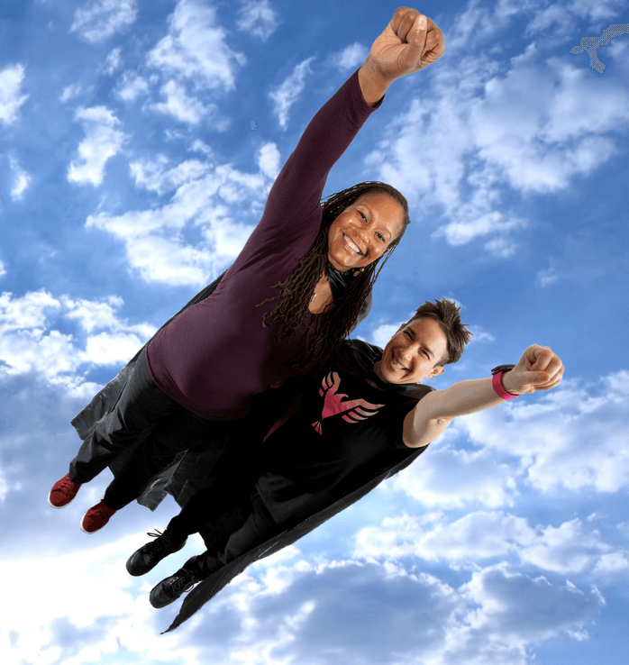 Dr. Lyle and Dr. San Miguel take flight against a sky backdrop