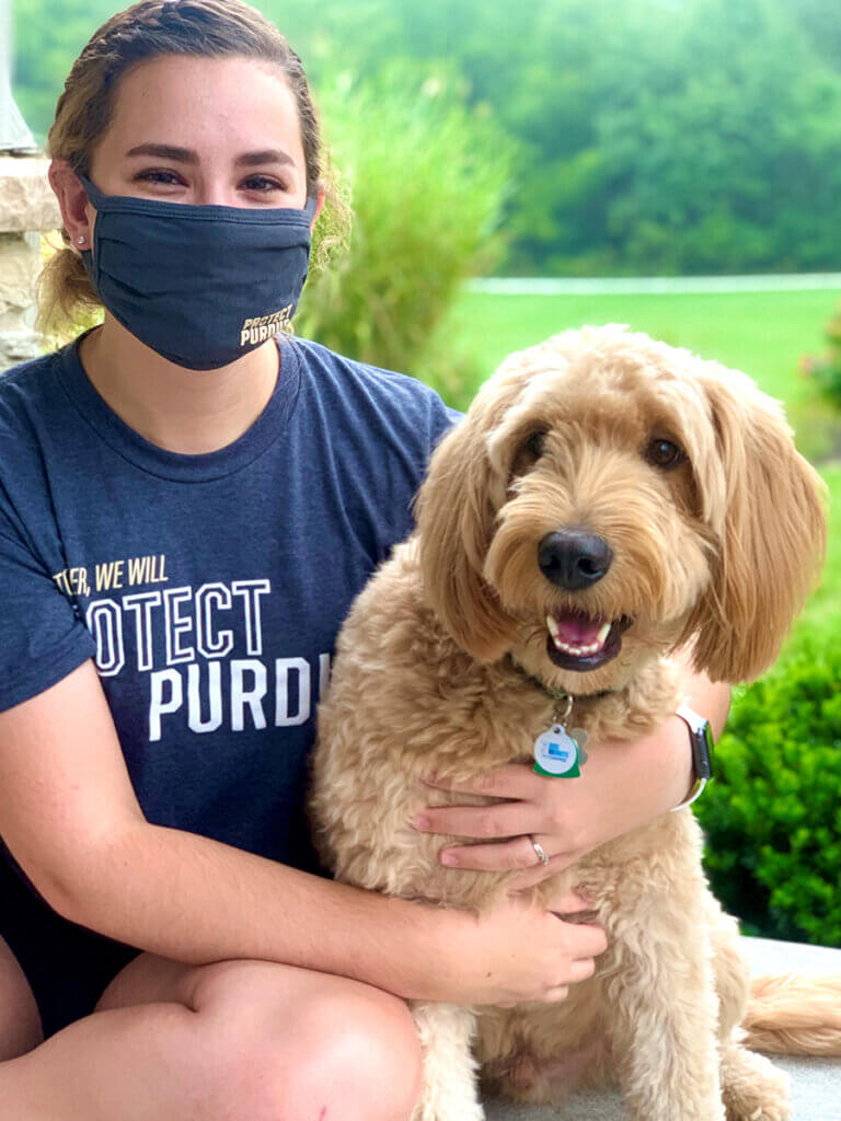 Alayna Baker holds her pup