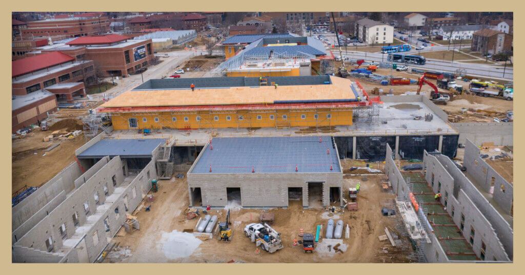 A photo shows an overhead view of construction progress on the new equine hospital and small animal hospital adjacent to the existing facilities