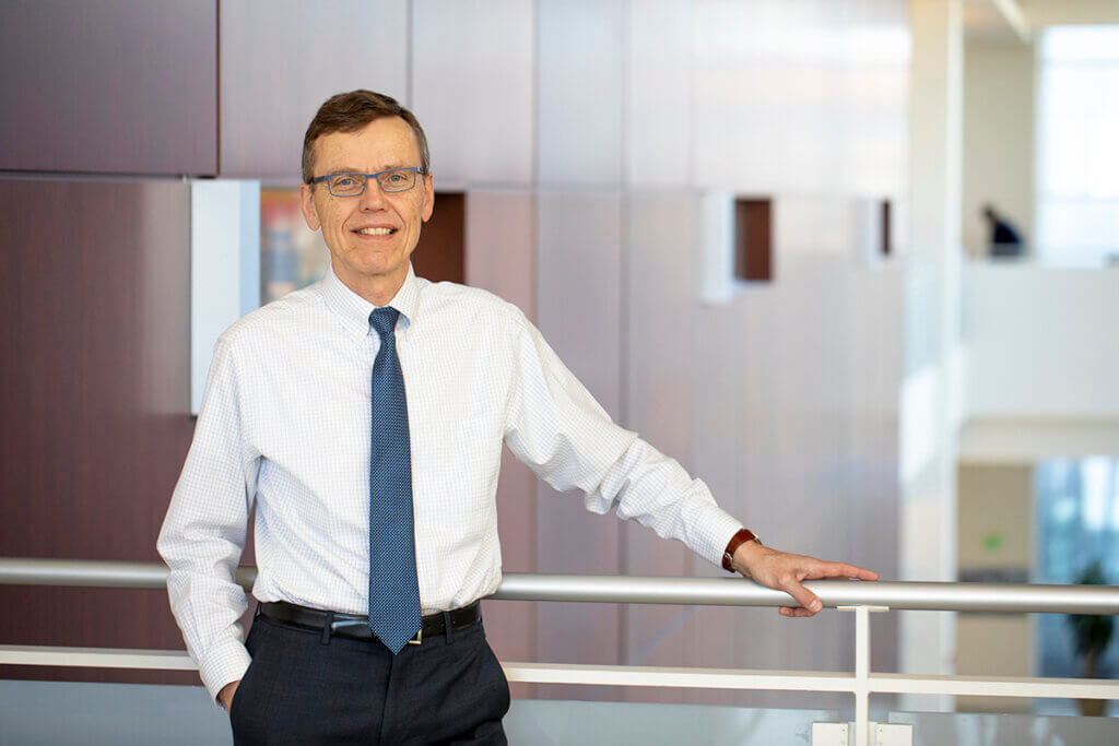 Portrait of Dr. HogenEsch leaning against a railing in the Bindley Bioscience Center at Purdue