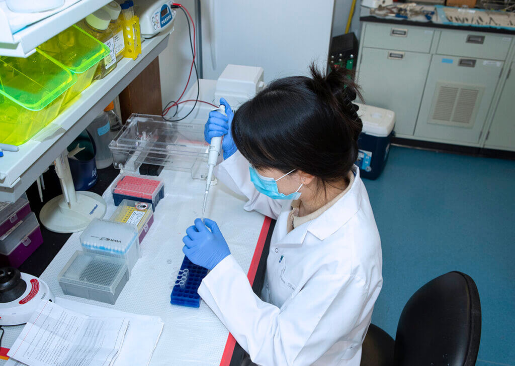 Xiaoyu works at a station in the lab