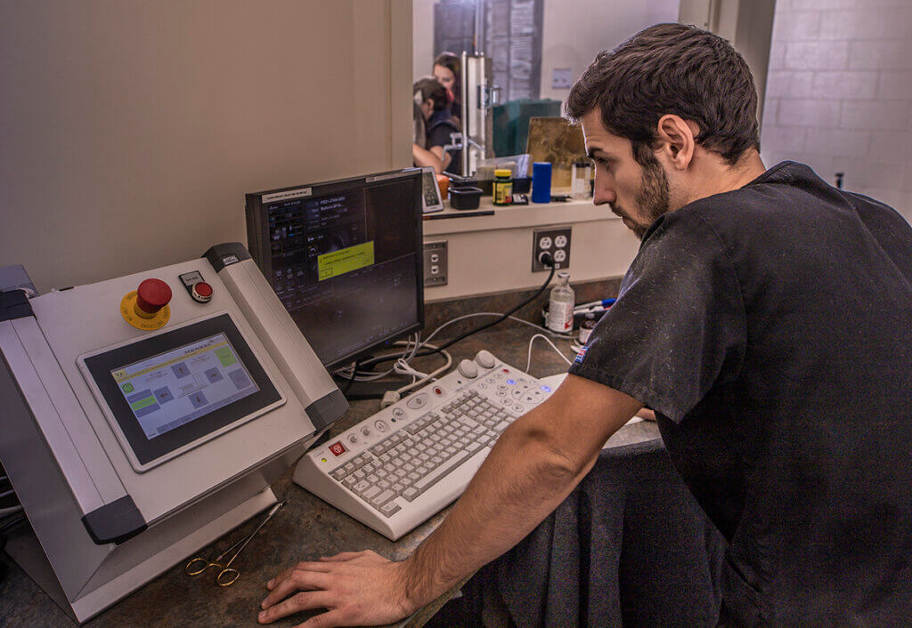 Dr. Garcia works on the CT computer program