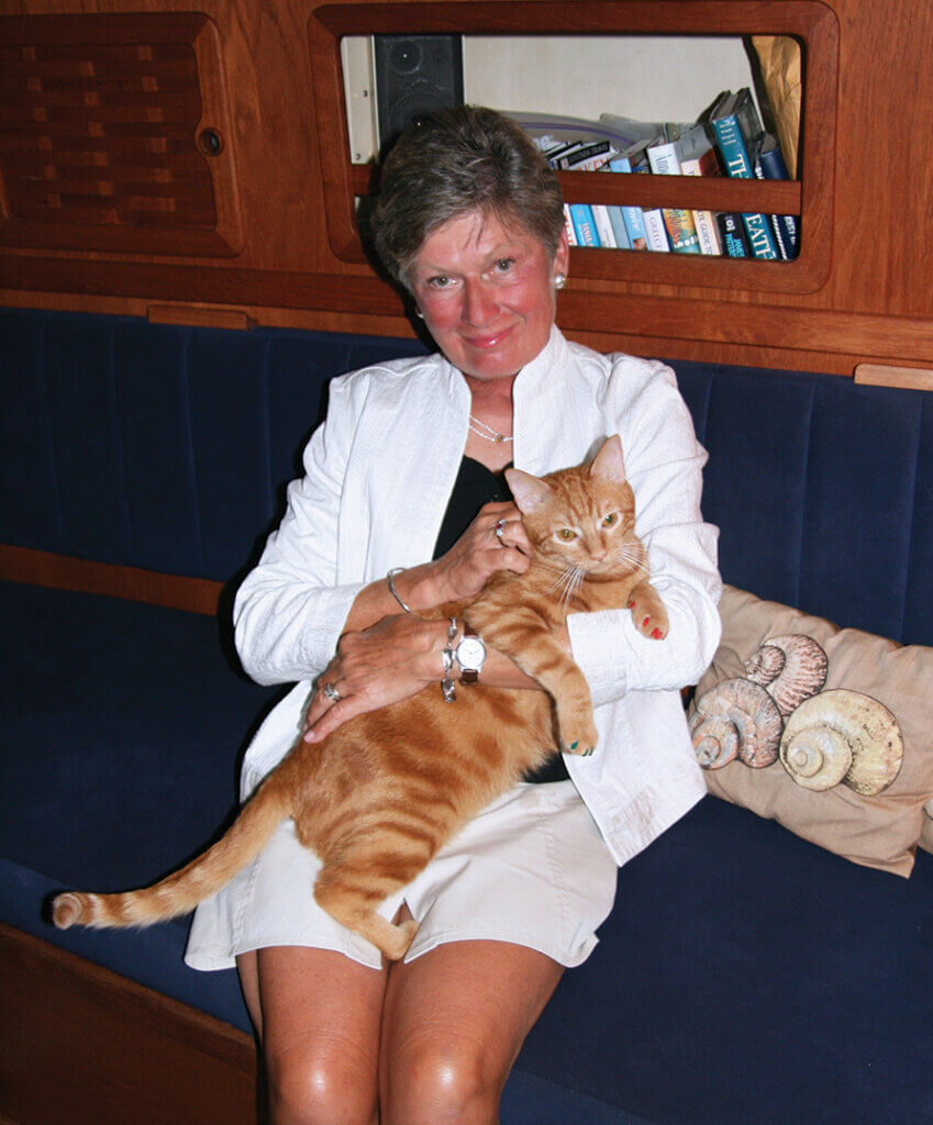 Janice pictured sitting holding her cat