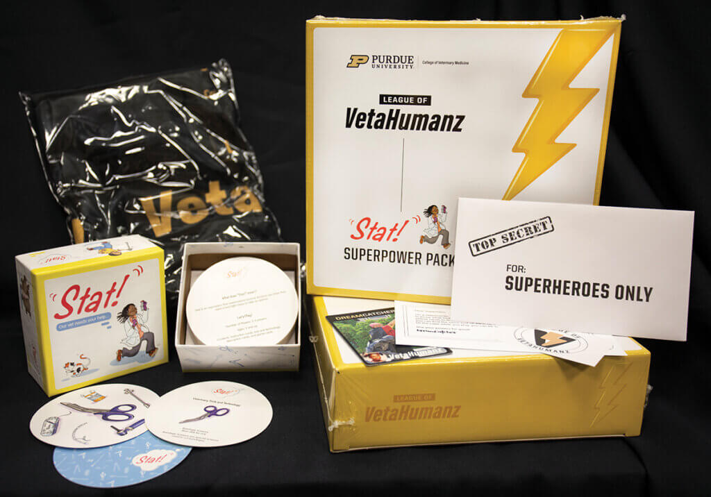 An unboxing pictured of the "Stat!" SuperPower Pack with items included in the pack displayed