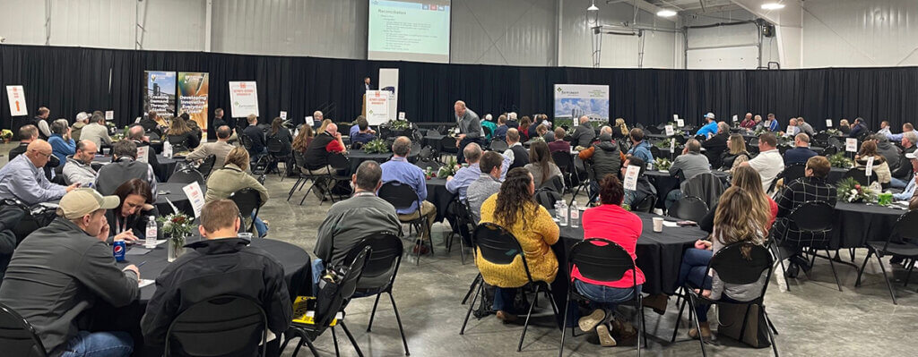 a group photo of a conference session