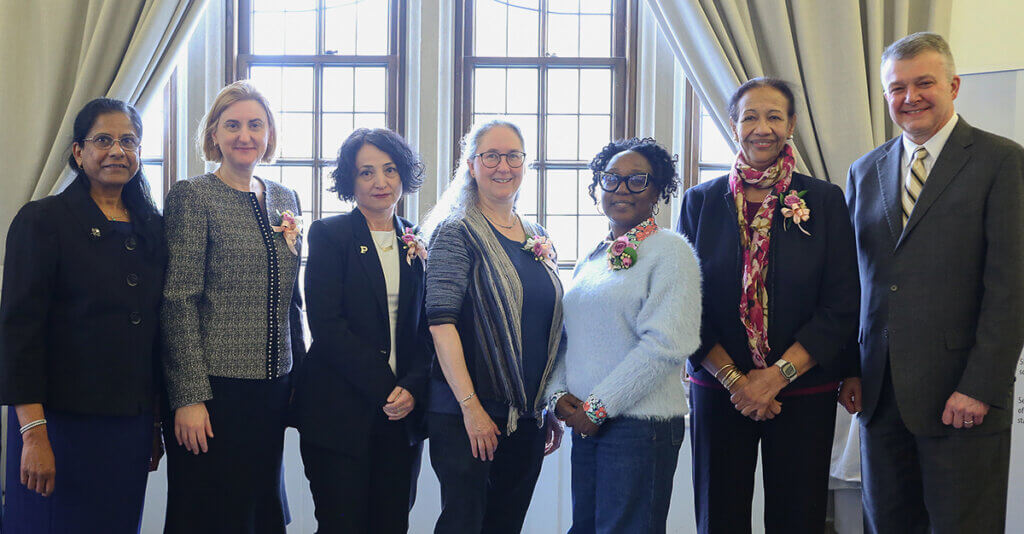 The Distinguished Women Scholars are joined by Provost Akridge for a group photo at the event