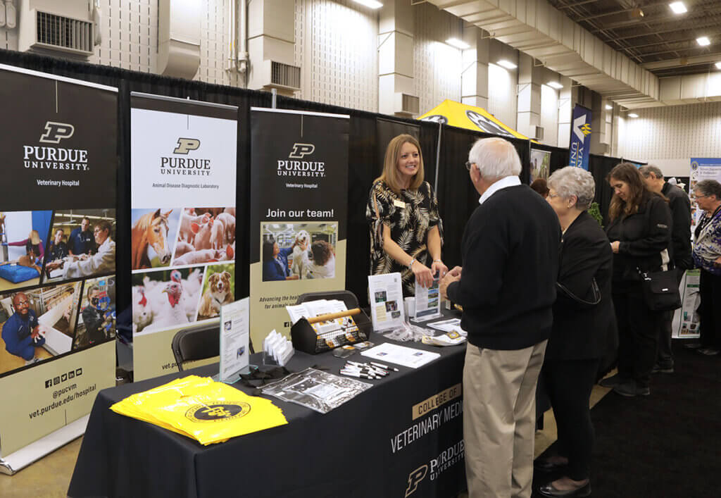 Tanya smiles as she greets guests to the PVM booth at the Ag Alumni Fish Fry