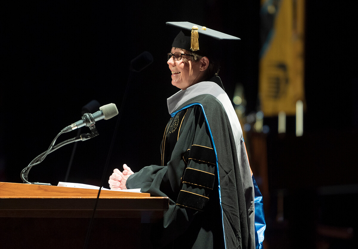 Dr. Deborah Knapp delivers commencement speech in ceremonial cap and gown