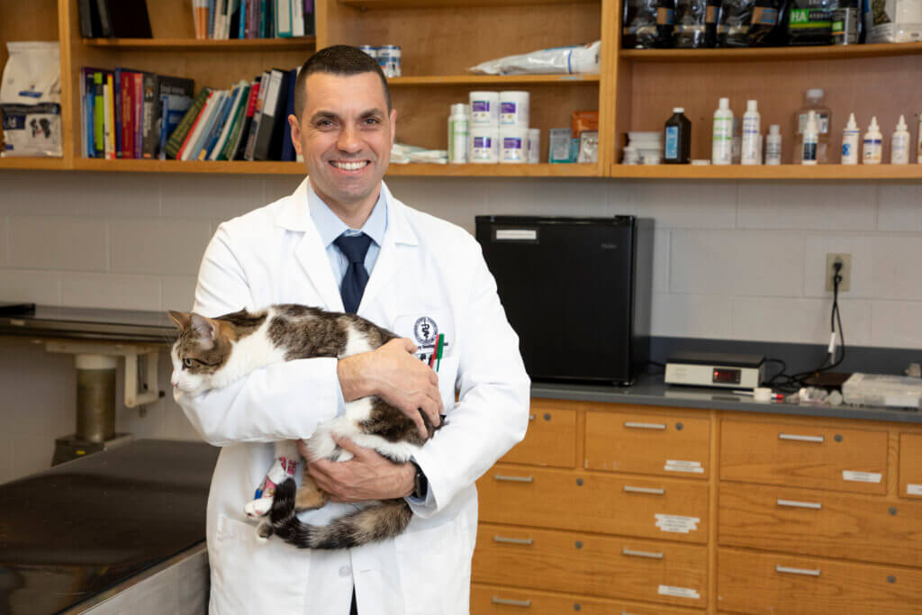 Dr Gomes holding a cat