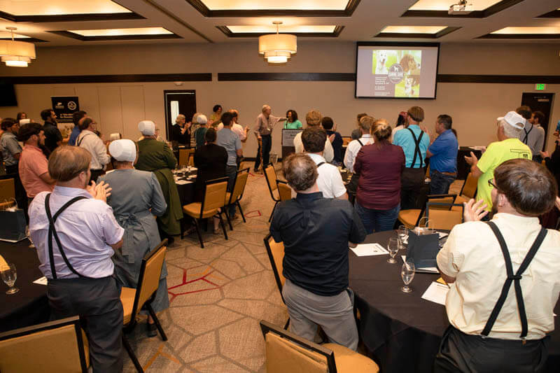 attendees honor Dr. Candace Croney with a standing ovation for her leadership of and commitment