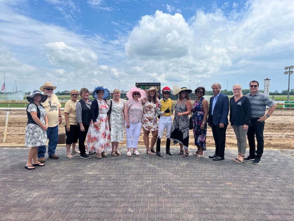 Winning jockey in the Indiana Derby, James Graham, who rode the horse Actuator to victory, joined Purdue Veterinary Medicine Dean Willie Reed and his wife Dorothy (third and fourth from right) along with other PVM guests in the Winner’s Circle after the race.
