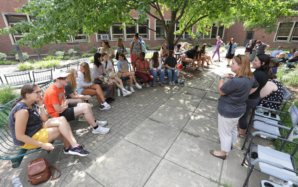 Students and staff prepare for an ice cream social in the courtyard