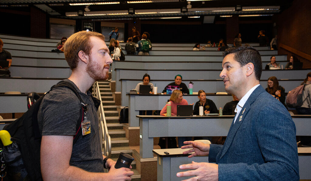 Liam and Dr. Borboroglu visit as students begin to clear out of the classroom