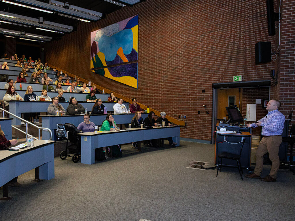A full lecture hall in Lynn 1136 greeted Dr. Chad Brown, Purdue Veterinary Nursing Programs director, as he gave introductory remarks to begin the program.
