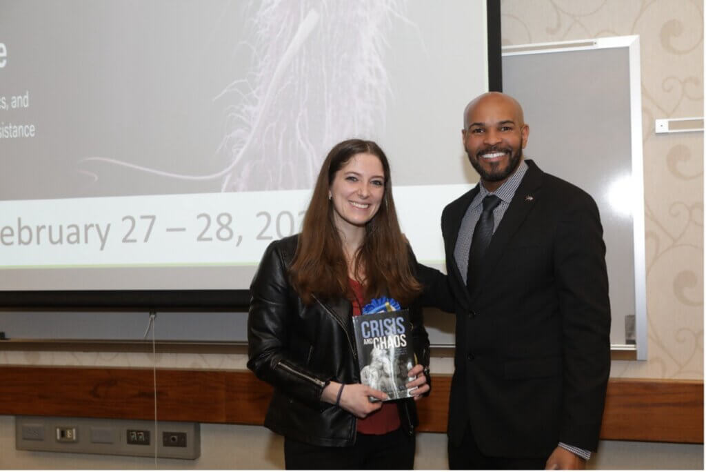 Molly Youse, a graduate student in the College of Pharmacy, was honored by Dr. Jerome Adams for winning first place in the Graduate Student Division of the Poster competition.