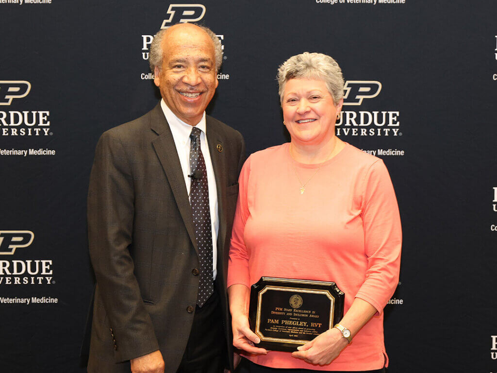 Dean Reed presented the 2024 Staff Excellence in Diversity and Inclusion Award to Pam Phegley, RVT