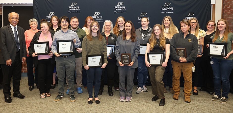 Following the awards ceremony, the Bravo Award recipients gathered at the front Lynn 1136 where they were joined by Dean Reed and those who received the Outstanding Staff Awards for a group photo.