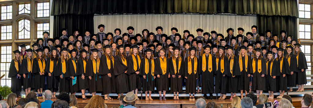 Veterinary Nursing and DVM graduates gathered together on stage for the PVM Class of 2024 photo.