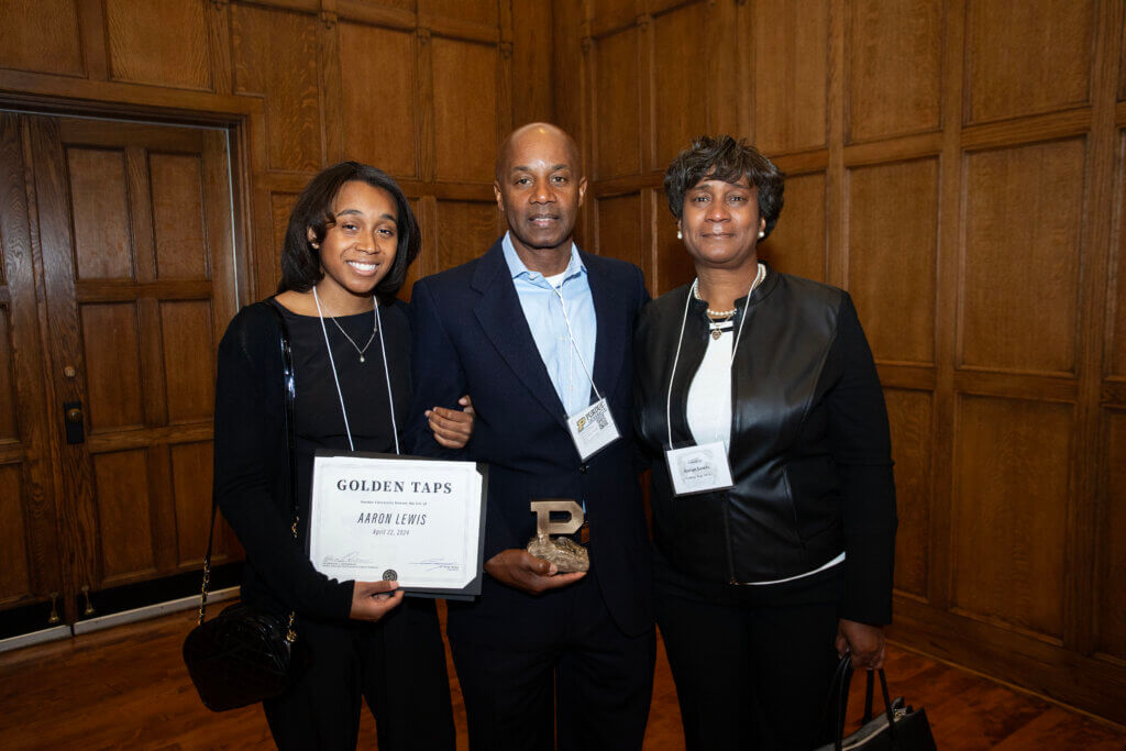 Aaron’s sister Jada and parents Patrick and Arnetta display the certificate and Unfinished Block P sculpture replica they received in memory of Aaron Lewis, who was a member of the Purdue DVM Class of 2025. Aaron’s other sister, Nicollette, was unable to attend due to another obligation.