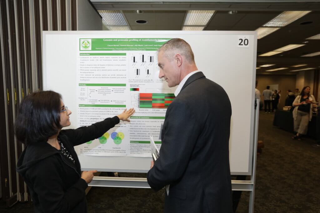 Postdoctoral Research Associate Chayan Sharma in the Department of Comparative Pathobiology, talks with an industry representative about her research poster entitled, “Genomic and Proteomic Profiling of Acanthamoeba Isolates.”