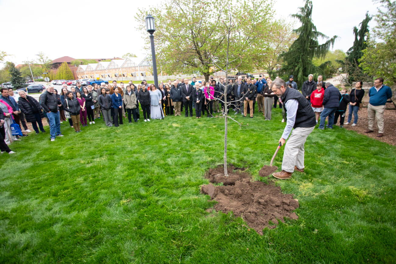 Purdue Veterinary Medicine faculty, staff and students gathered with friends and family of the late Professor of Basic Medical Sciences Russell Main for a memorial tree planting ceremony conducted in his honor in front of Lynn Hall April 23.