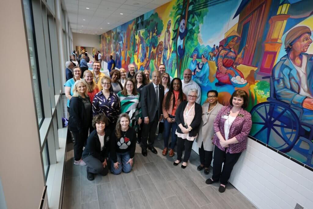 At the conclusion of the ceremony, faculty, staff and students who had helped with the project gathered for a group photo.