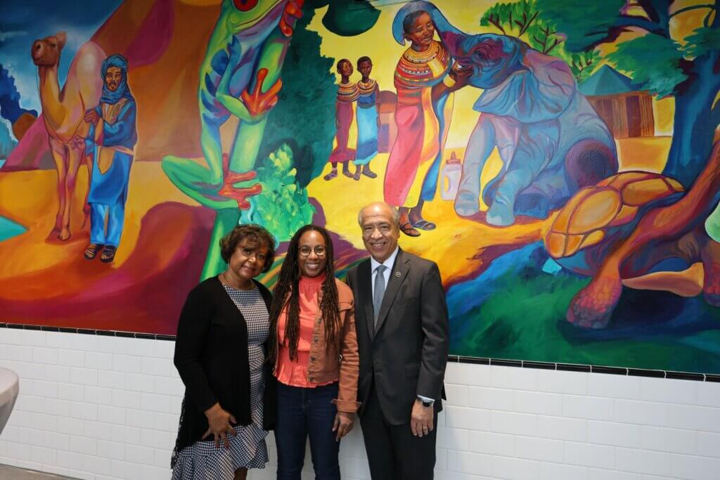Tia Richardson with Willie and Dorothy Reed pause for a photo with the mural as the backdrop.