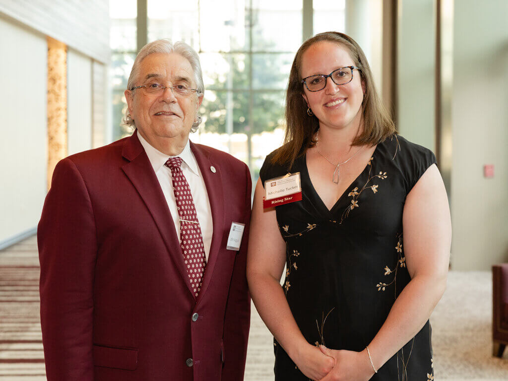 Dr. Michelle Tucker with Texas A&M School of Veterinary Medicine & Biomedical Sciences Dean John August.