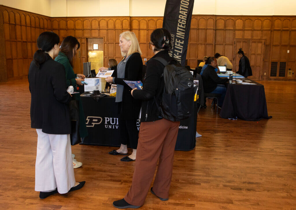 Purdue University Veterinary Hospital Marketing and Communications Manager Kelly Dold shares information about the hospital’s services with attendees at the Healthy Boiler Fair in the Purdue Memorial Union.