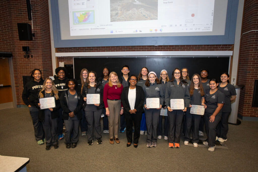 Recipients of the Certificate for Diversity and Inclusion in Veterinary Medicine who were present for the recognition ceremony gathered for a group photo with Interim Dean Salisbury and Marsha Baker (Front Row, left-right): Lois Sadlowski, Nailah Smith, Anne Troyer, Dr. Kathy Salisbury, Marsha Baker, Madeline Frey, Bridget Stratman, Natalie Sulewski, and Victoria Menendez (Back Row, left-right): Azure Patterson, Tamea Smith, Makaylah Hamm, Amanda Mills, Albert Chu, Rachel Cooper-Khan, Becca Contestabile, Cami Contestabile, Vyonie Manley, and Ivanna Marroquin.