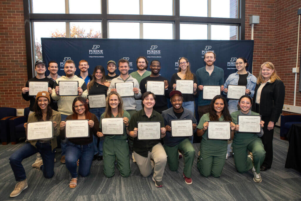 Veterinary students who were able to attend the reception to receive their Global Engagement Certificates in person paused for a group photo after being introduced: (Front Row, left-right) Maija Woodruff, Krystal Nieves Aviles, Paige Kinzie, Ally Eaton, Adrian Dixon, and Angela Ruiz; (Back Row): Thomas Watson, Elliott Westrich, Collin Herron , Andrea Gonzalez, Dalton Whitehead, Brandon Bardin, Jacob Mishne, Kyle Barron, Emma Nikolai, Liam Quaas, and Wilnelys Tirado.