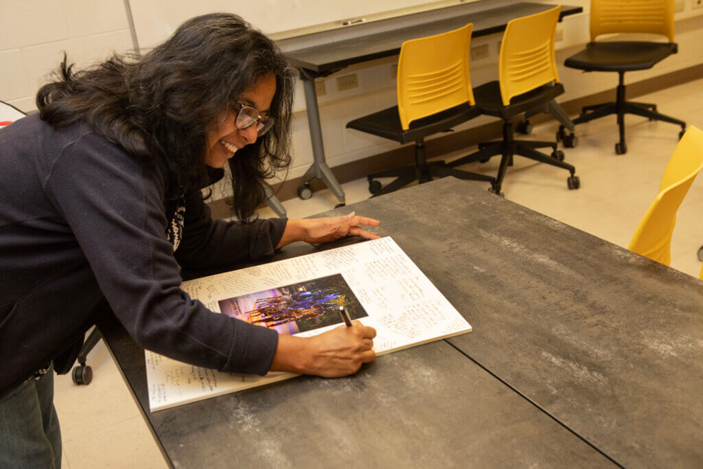 Colleagues had the opportunity at Dr. Brown’s reception to autograph a mat for a framed picture of the Continuum Sculpture given to Dr. Brown in recognition of his service to the college.